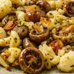 Garlic Mushrooms Cauliflower Skillet served on a plate with roasted mushrooms and cauliflower