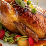Glossy orange marmalade chicken served with greens, root vegetables, and a citrus glaze.