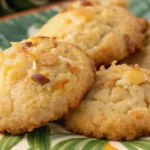 Close-up of soft pineapple cookies with coconut and macadamia on a tropical plate